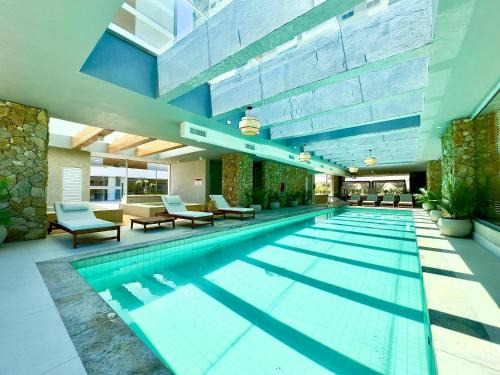 Picarras Apartment | Apartamento em Condomínio Frente-Mar com Piscinas, Jacuzzi Aquecida, Sauna, Academia, Brinquedoteca, Churrasqueira na Sacada, Cozinha Completa e Lazer de Home Club