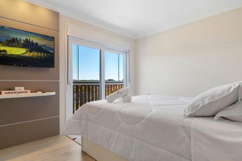 Canela Apartment | Apartamento HodsPrime com 2 Suítes by Achei