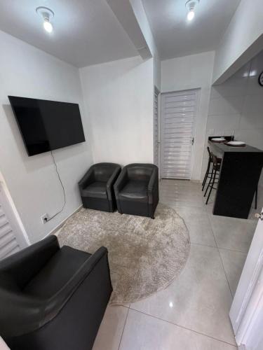 Tramandai Apartment | Apartamento térreo no Centro de Tramandaí, com ar condicionado, garagem e churrasqueira