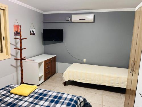 Nonoai House | Apzito Tri com garagem