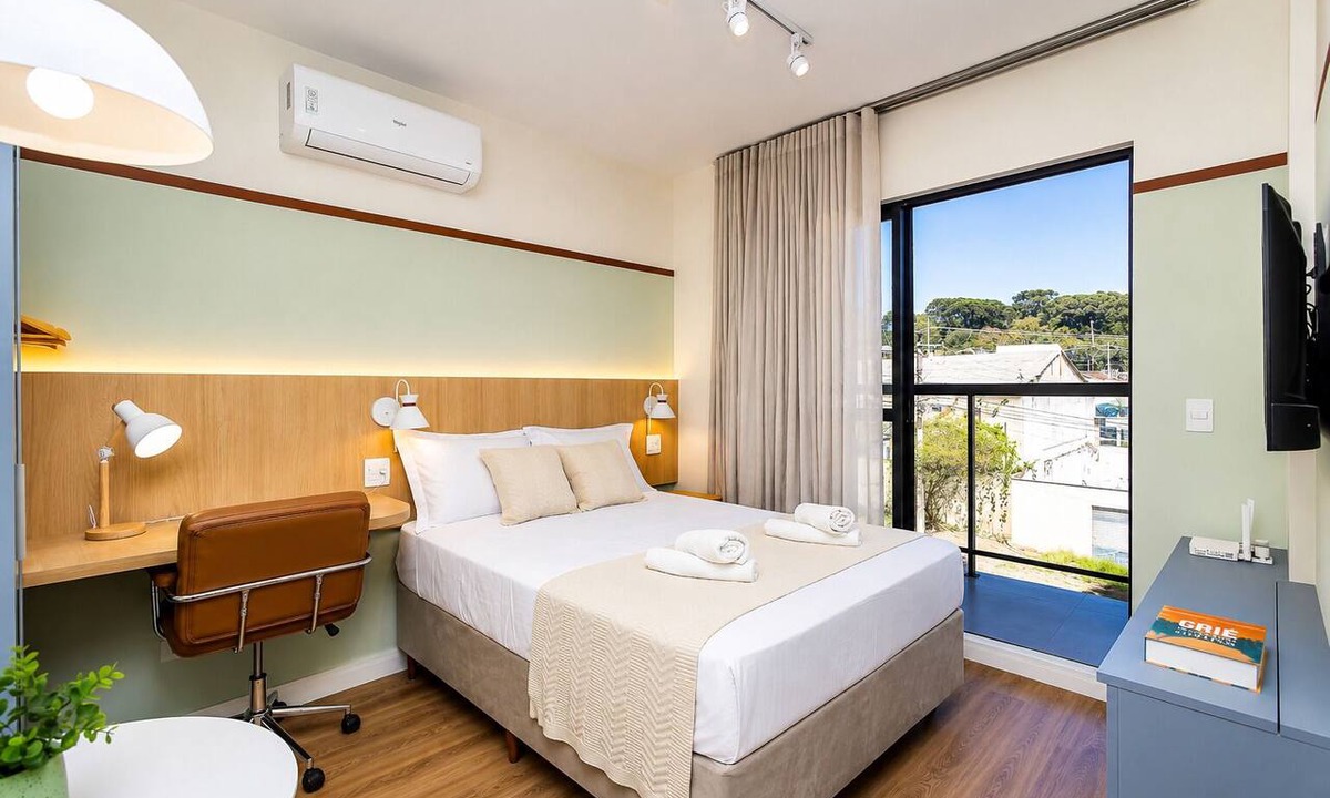 Boa Vista Apartment | Comfortable studio apartment with garage, balcony, air conditioning (hot/cold), and gym.
