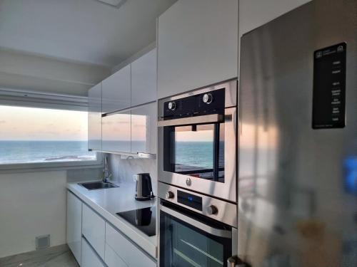 La Perla Apartment | Departamento Pinterest Mar del Plata - Vista plena al mar con cochera