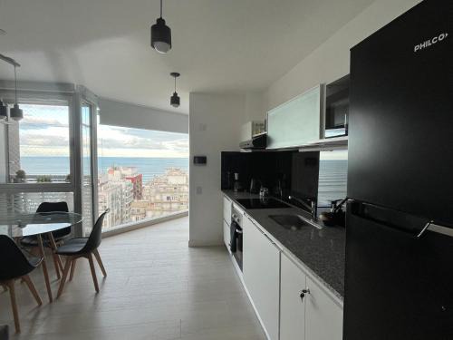 La Perla Apartment | Excelente! Vista al mar con cochera y amenities gimnasio, play room y pileta climatizada