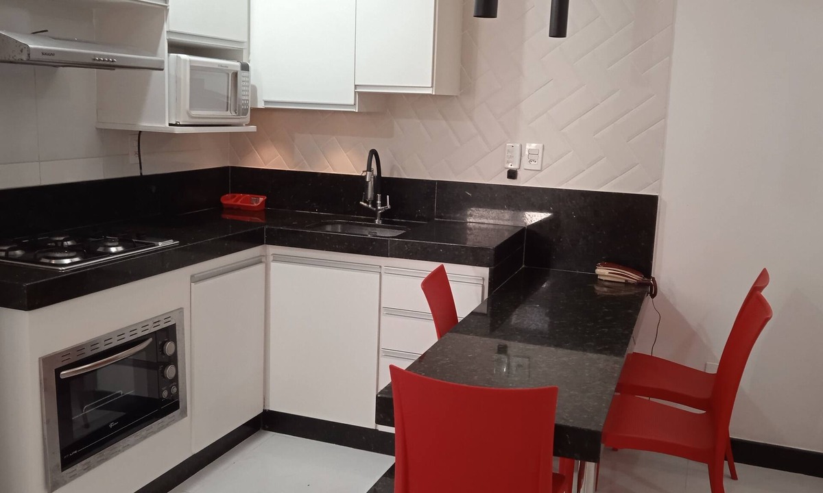 Centro Apartment | Located 100 meters from Castanheiras Beach, this property features a garage, Wi-Fi, beach chairs, and a cooler.