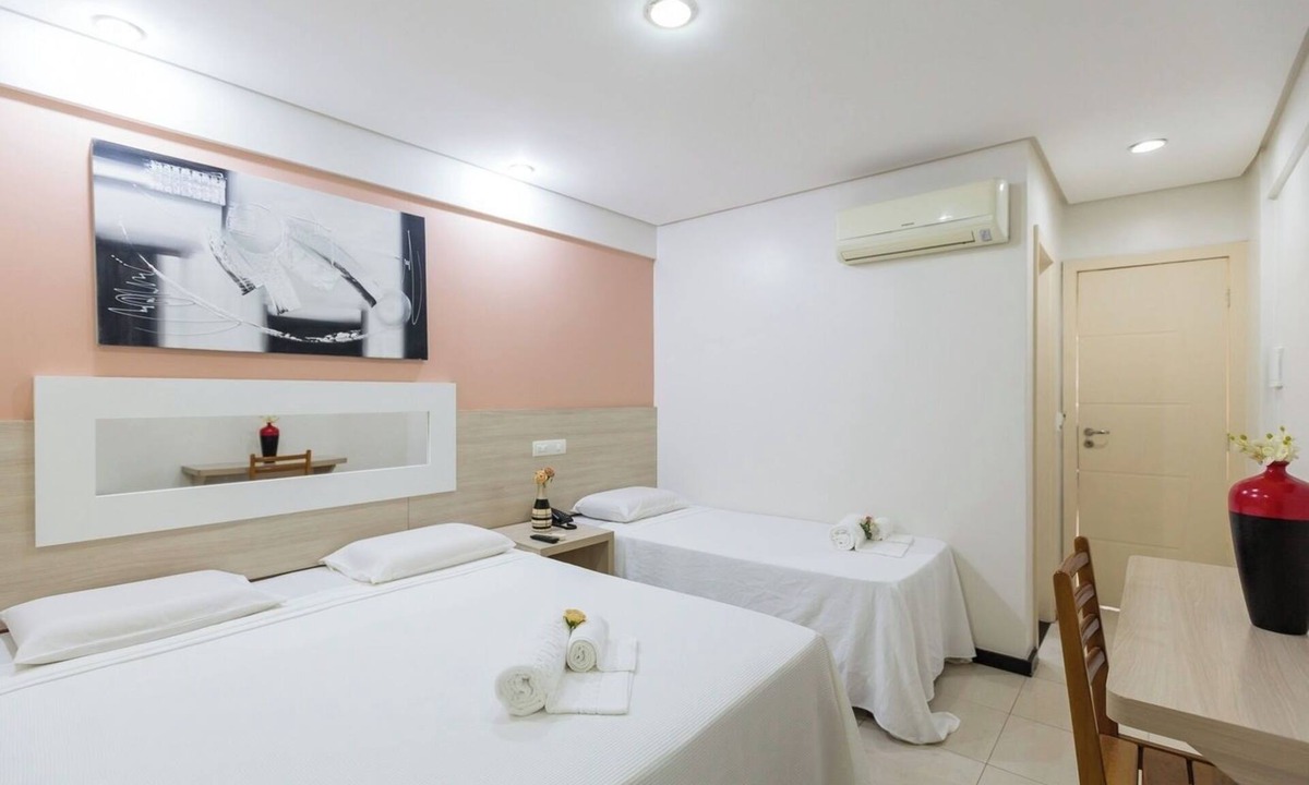Eunapolis Hotel | Modern Triple Room in Centro | Walk to Local Stores, Free Breakfast & Parking