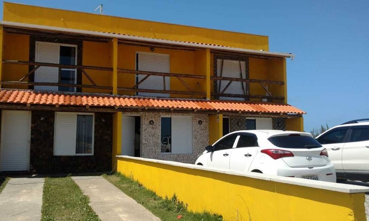 Jaguaruna House | Rust Stone House with Balcony, Hammock and Sea View - 180m from the beach