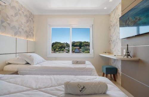 Canela Apartment | Apartamento HodsPrime com 2 Suítes by Achei