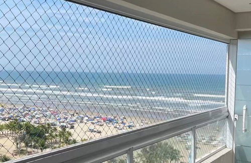 Mirim Apartment | Apartment facing the sea, 60 meters from the beach. Air conditioning and safety netting throughout.
