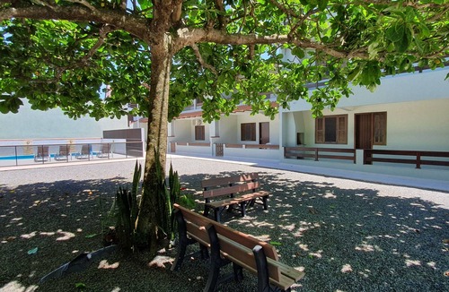Itapoa Apartment | Apartment in a gated community with a swimming pool.