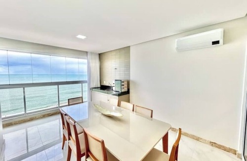 Praia do Morro Apartment | Beachfront apartment in Praia do Morro with air conditioning and barbecue.