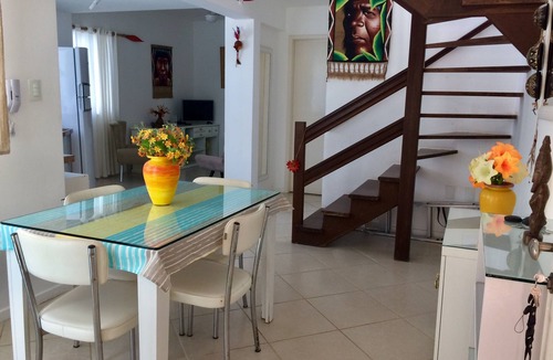 Centro Apartment | Beautiful beach in Praia dos Anjos with private barbecue, air conditioning, cable TV, WiFi, and beach view.
