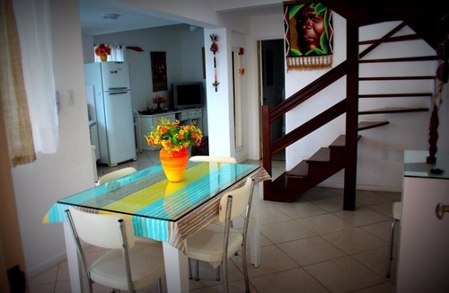 Centro Apartment | Beautiful beach in Praia dos Anjos with private barbecue, air conditioning, cable TV, WiFi, and beach view.