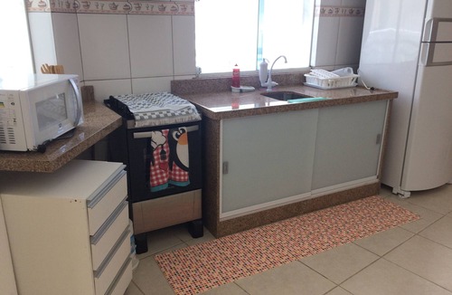 Centro Apartment | Beautiful beach in Praia dos Anjos with private barbecue, air conditioning, cable TV, WiFi, and beach view.