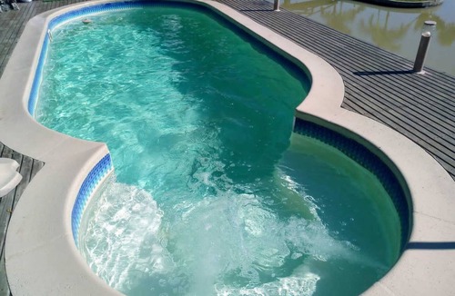 Aurora Cottage | Beautiful site with swimming pool and pond to relax in