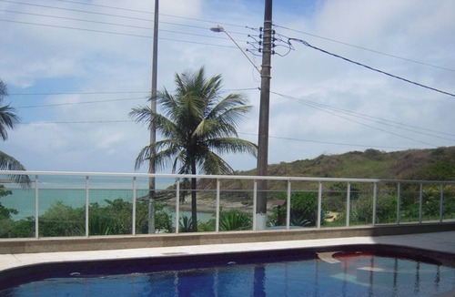 Guarapari Apartment | Building facing elegant Bacutia beach (Blue Cove)