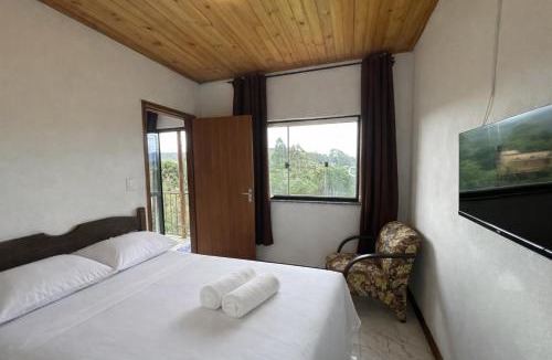 Lavras Novas Apartment | Casa com 2 suítes e varanda em Lavras Novas