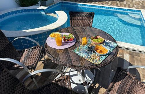 Jardim Casablanca House | Casa em Peruíbe, Piscina, Hidro, Ar condicionado, Churrasqueira