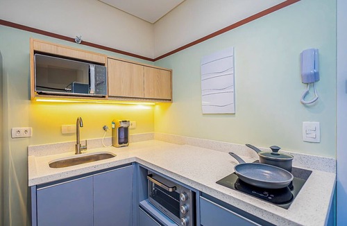 Boa Vista Apartment | Comfortable studio apartment with garage, balcony, air conditioning (hot/cold), and gym.