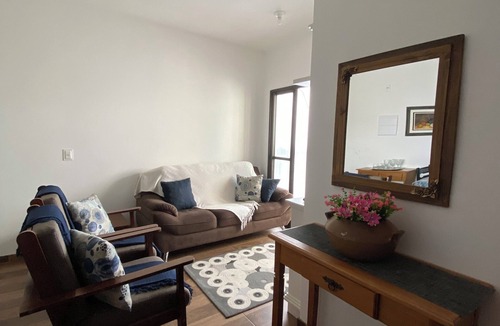 Campos do Jordao Apartment | Cozy apartment with 2 bedrooms, kitchen, fireplace and mountain views.