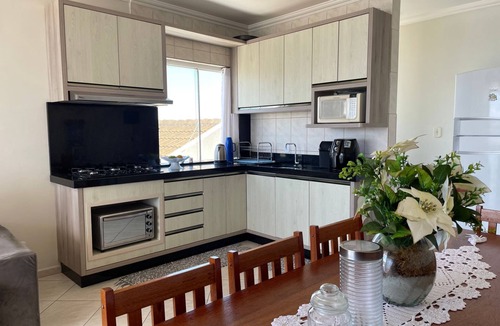 Enseada Apartment | Cozy beachfront apartment in Enseada, ideal for families and groups.