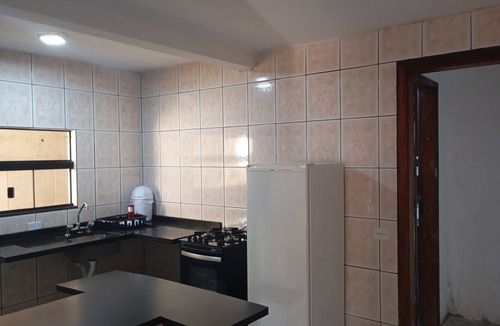 Fazenda Rio Grande Apartment | Cozy house with a private space on the lower level of the two-story house with a kitchen.