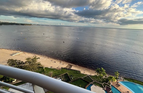 Ponta Negra Apartment | Flat River View - With a balcony and spectacular views of the Rio Negro.