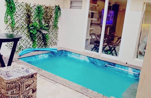 Zona Leste House | Heated pool and fireplace for couples