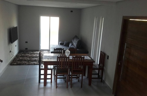 Pontal da Cruz House | House accommodates 9 people, large living room, 2 balconies, TV, Netflix, Wi-Fi, beautiful beach.
