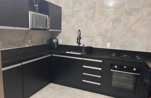 Marica House | House in a gated community, with pool and barbecue area.
