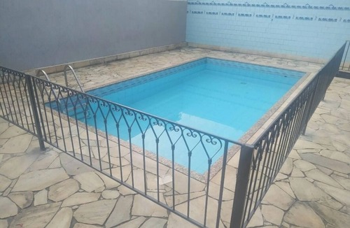 Marica House | House in a gated community, with pool and barbecue area.