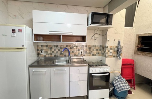 Tramandai Apartment | House with 2 suites, 1 parking space, barbecue, close to the sea.