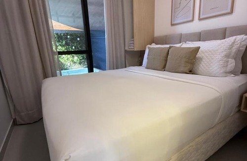 Novo Mundo Apartment | Kalm Stay Refugio com Hidromassagem e Cromoterapia