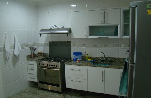 Algodoal Apartment | Luxurious 4-suite apartment with gourmet kitchen and large balcony overlooking the sea.