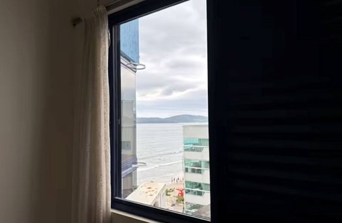 Itapema Apartment | Ocean view with barbecue, air conditioning and garage.
