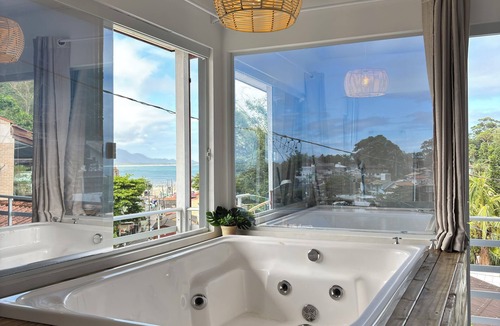 Florianopolis Apartment | Private Jacuzzi with ocean view.
