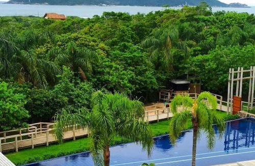 Campeche Norte Apartment | Refúgio VIP Pé na Areia no Campeche - Piscina, Sauna e Academia até 08 pessoas