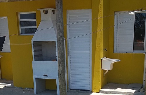 Jaguaruna House | Rust Stone House with Balcony, Hammock and Sea View - 180m from the beach
