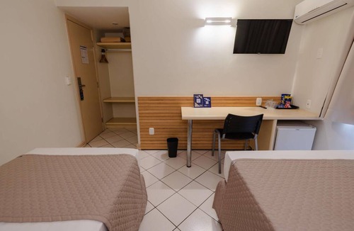 Umuarama Hotel | Simple Yet Practical Room l Close Orlando de Carvalho Airport - 3.1 miles
