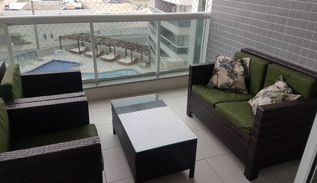 Apartment across from Praia Grande beach with an excellent view/unparalleled sunset!
