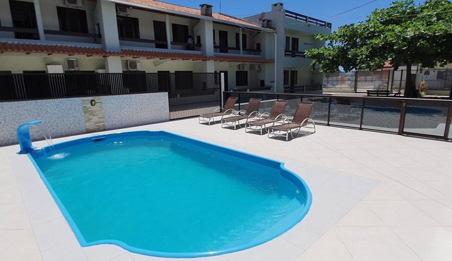 Apartment in a gated community with a swimming pool.