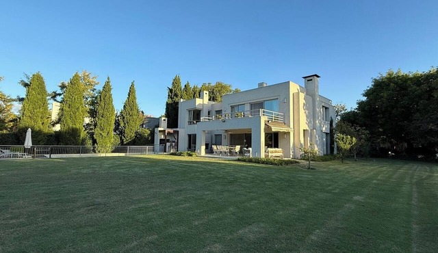 Ayres de Pilar house with a large park and mature trees. in Manuel Alberti
