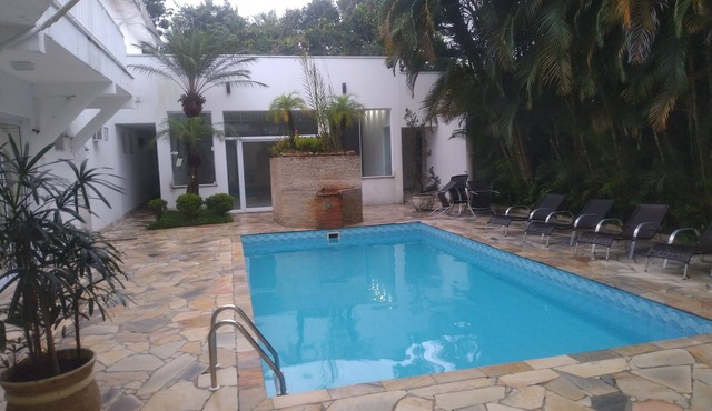 House 150 meters from the beach, 8 suites, Costa do Sol, Guaratuba, with party room. in Loteamento Costa do Sol Bertioga