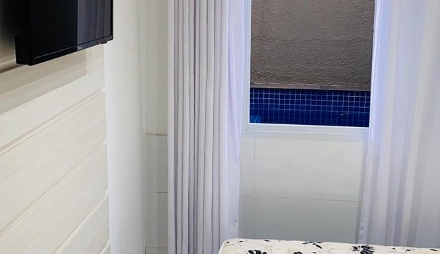 Casa com jacuzzi dentro de condomínio em Bertioga.