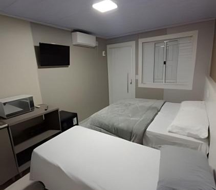 Loft Lux 4 Centro (Smart TV, ar-condicionado e cozinha completa)