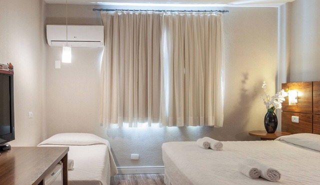 Luxurious Executive Triple Room Steps from Curitiba’s Best Parks and Landmark