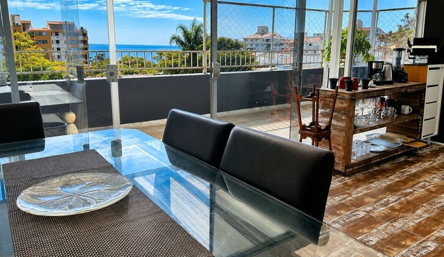 Penthouse with ocean view, one block from the beach, with private garage.