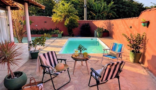 RETREAT IN MARICÁ: SUNSET POOL AND DECK.