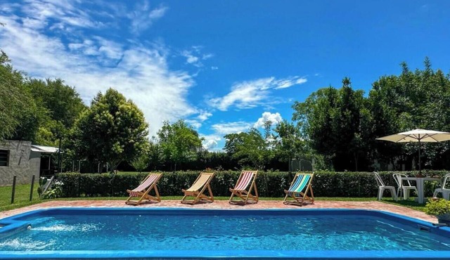 Rustic cabin with a pool. in Villa Lía