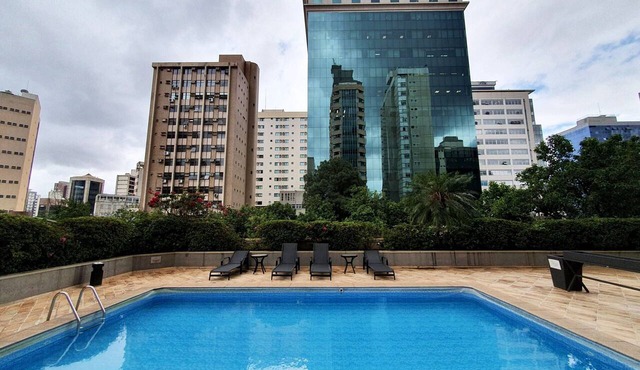 Spacious Savassi Suite with Balcony, Kitchen & City Views in Belo Horizonte