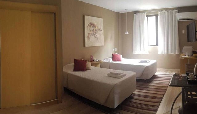 Stay Close to Curitiba’s Highlights in This Executive Double Twin Room Downtown